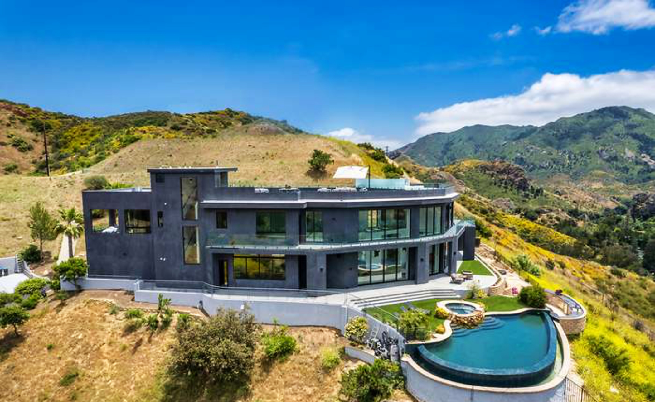 Aerial view of a completed contemporary hillside home