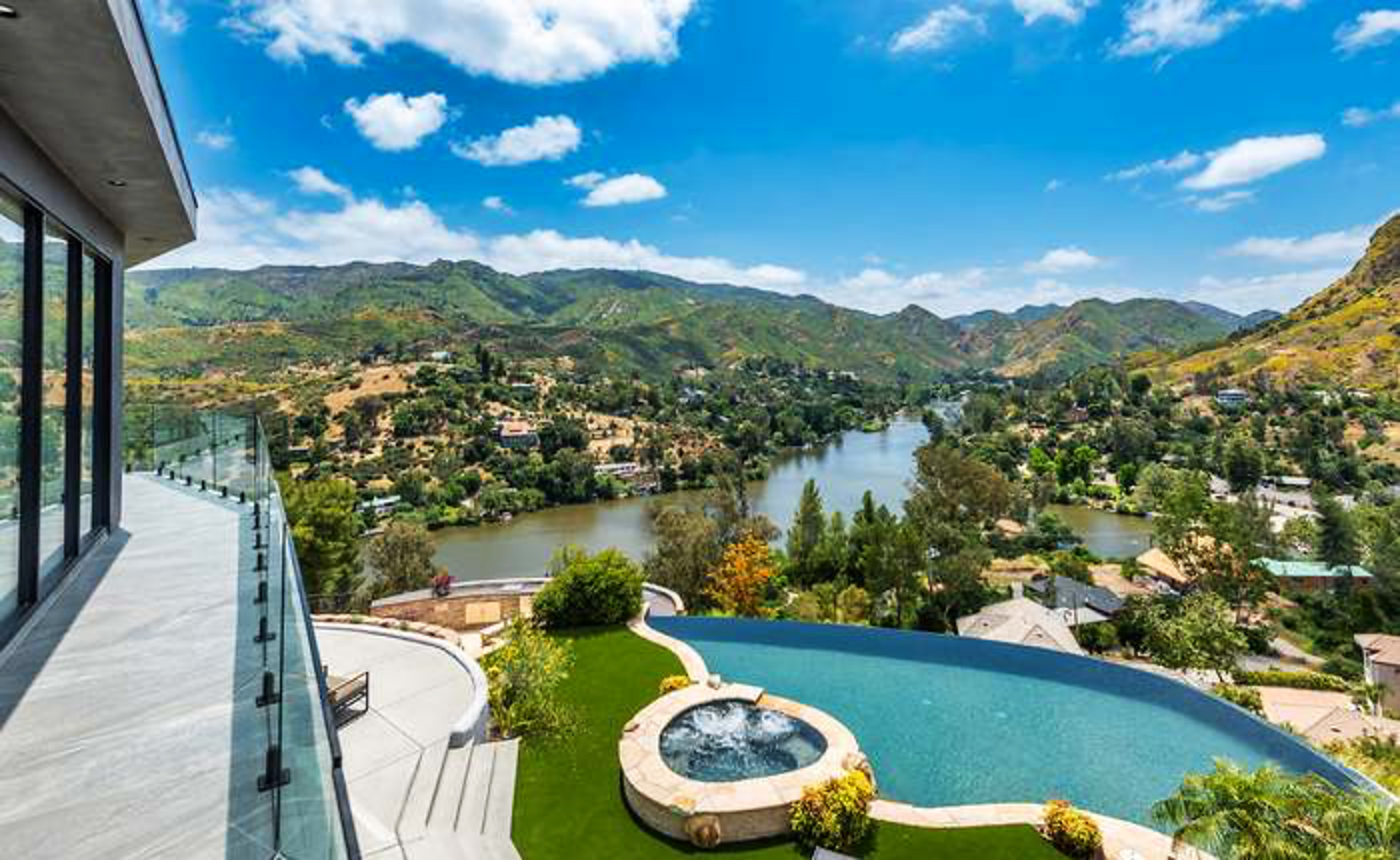 Balcony and infinity pool with lake view