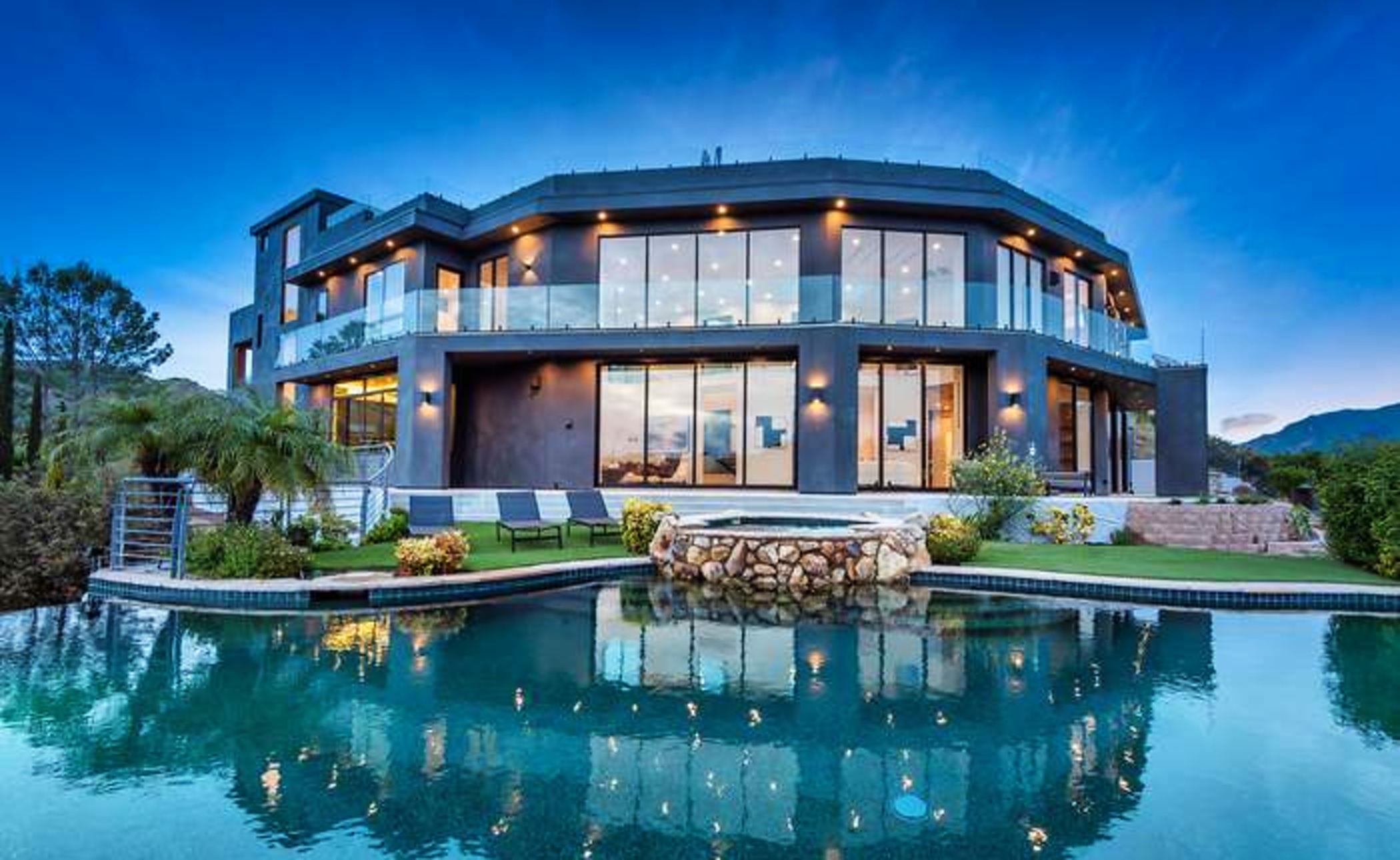 Poolside view of the residence at blue hour