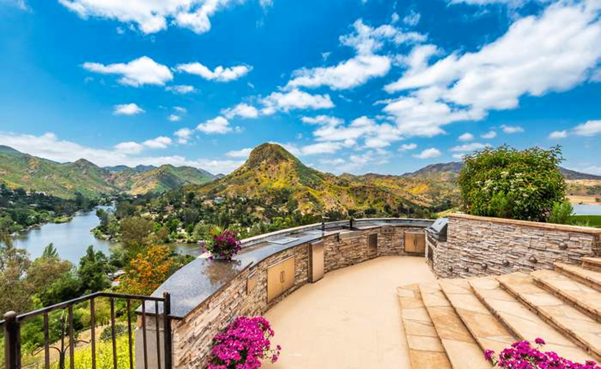 Stone terrace with mountain and lake views