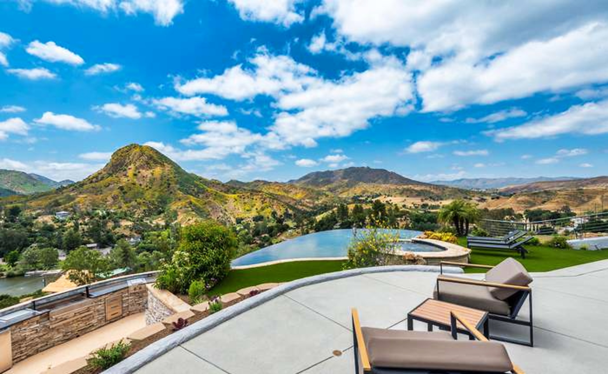 Terrace overlooking mountains and infinity pool
